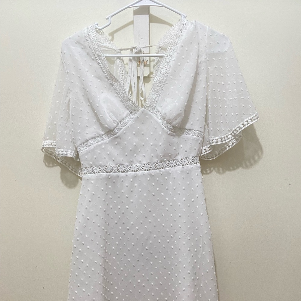 Short white dress brand unknown with tie in back